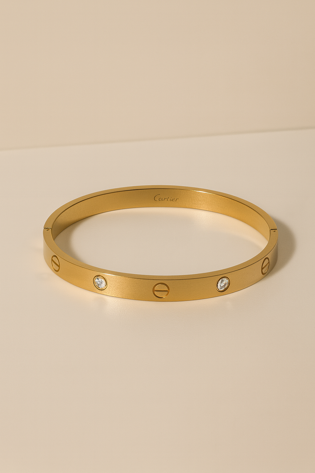 A sleek-gold tone bangle bracelet